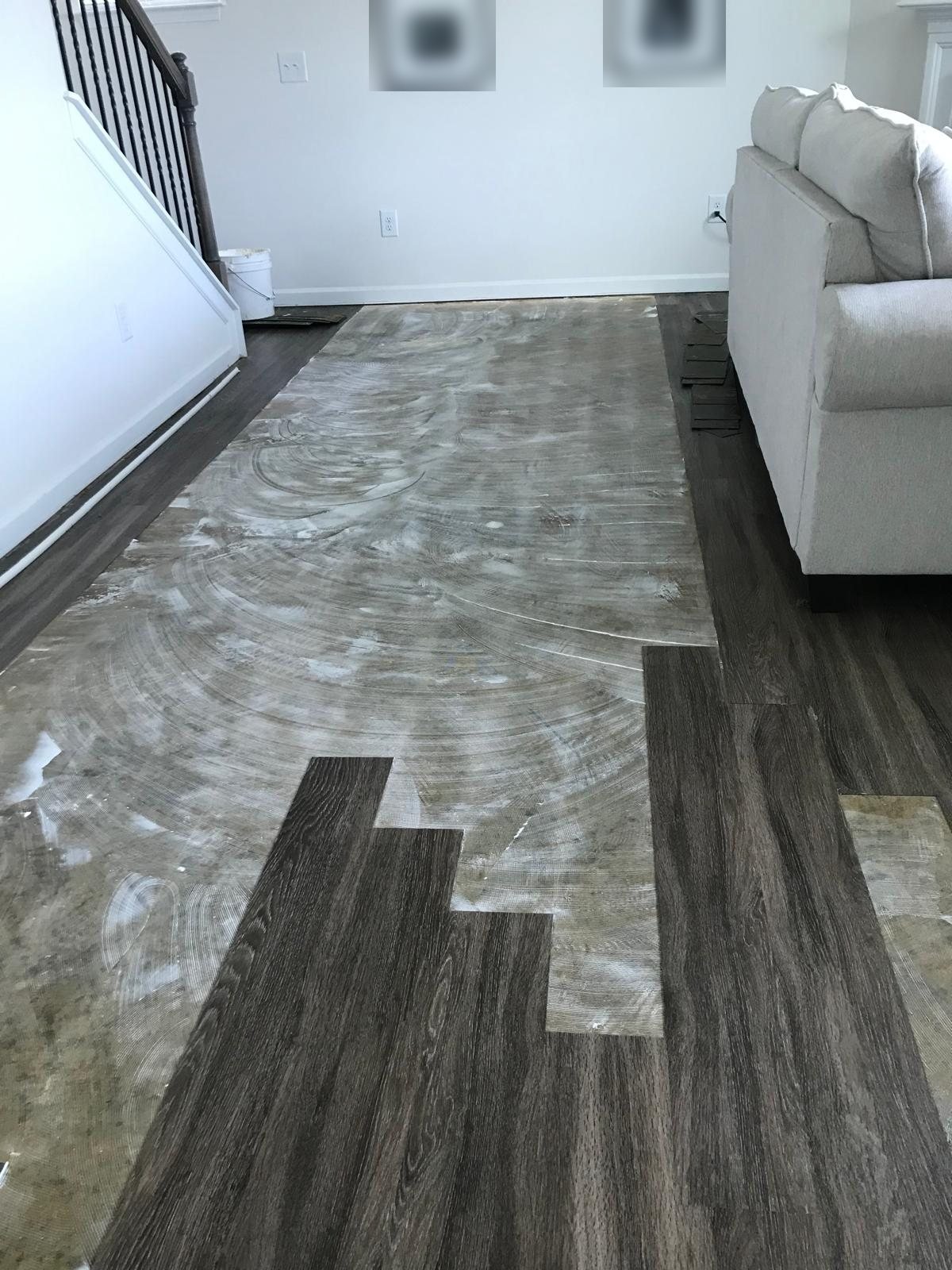 Before: Floor repair: section of planks replaced